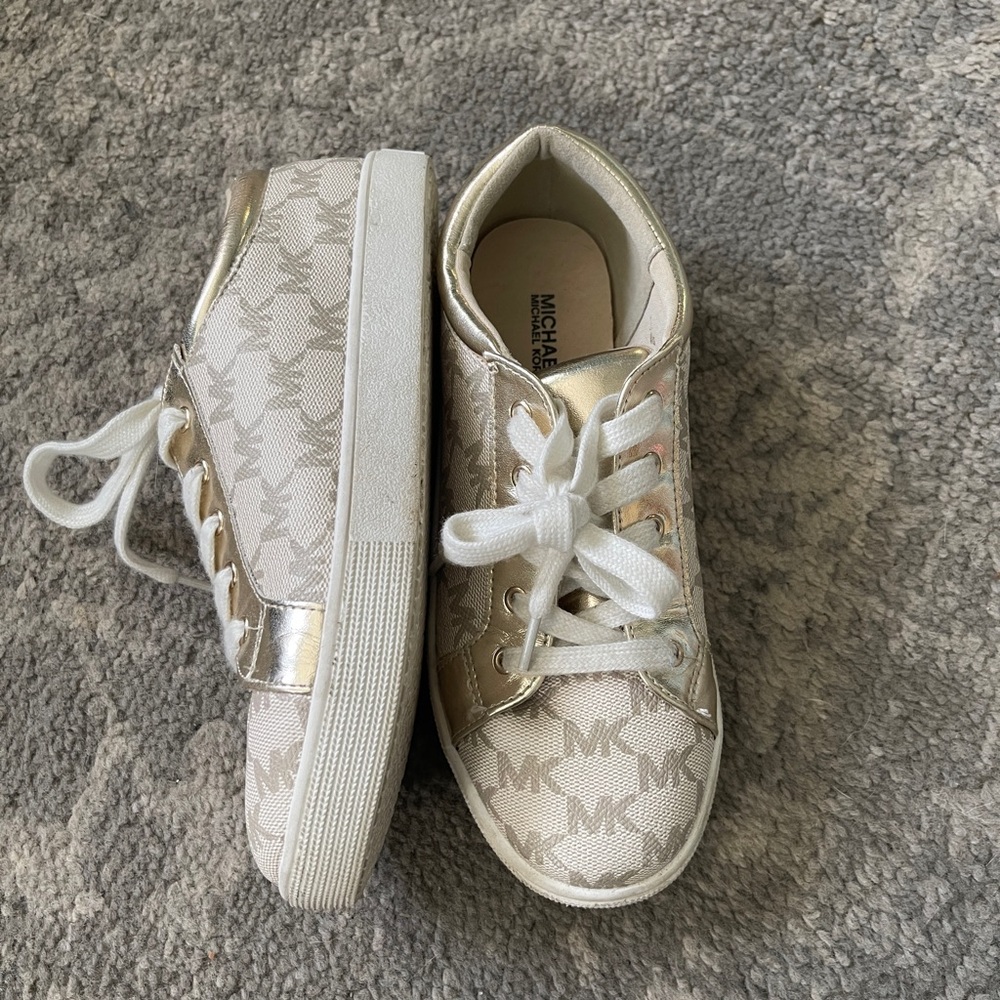 Lightly used. Worn once. Michael Kors size 3 shoes.